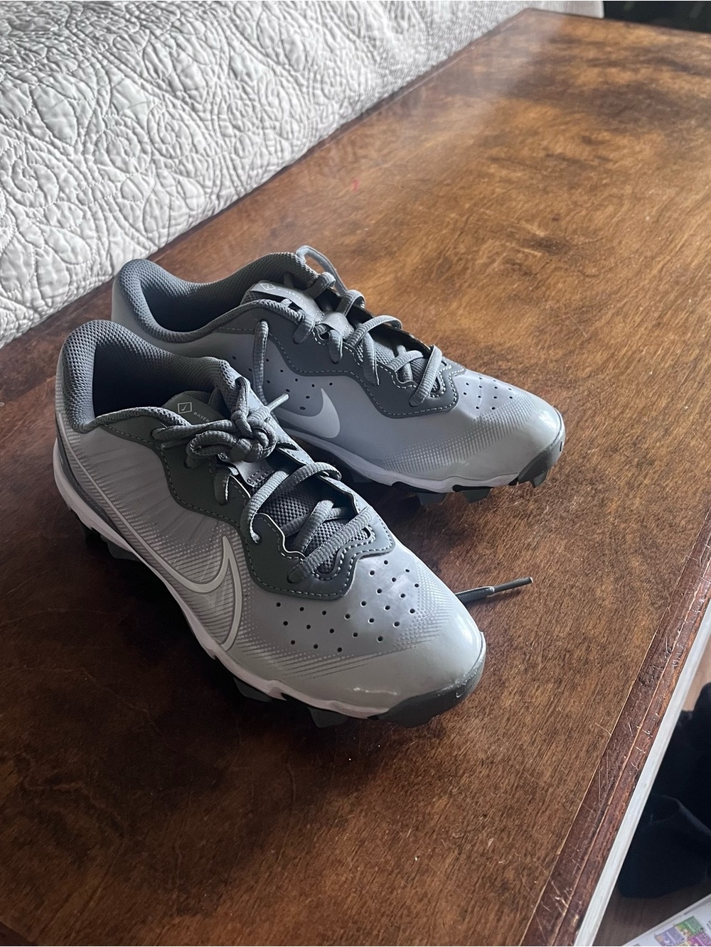 Nike Gray Youth Cleats with White Swoosh